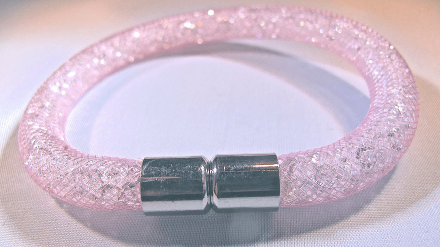 Pink bracelet filled with white crystals