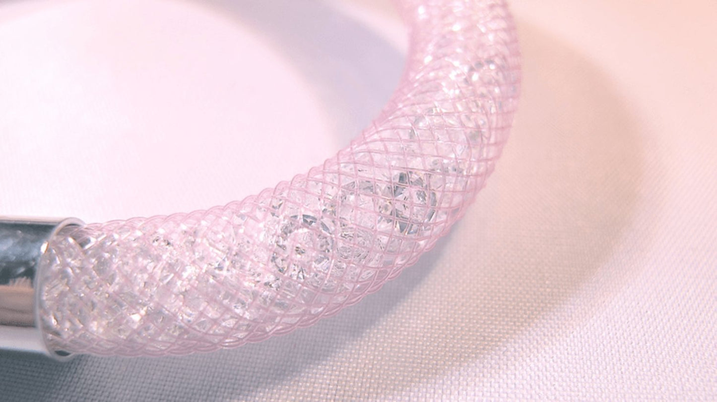 Pink bracelet filled with white crystals